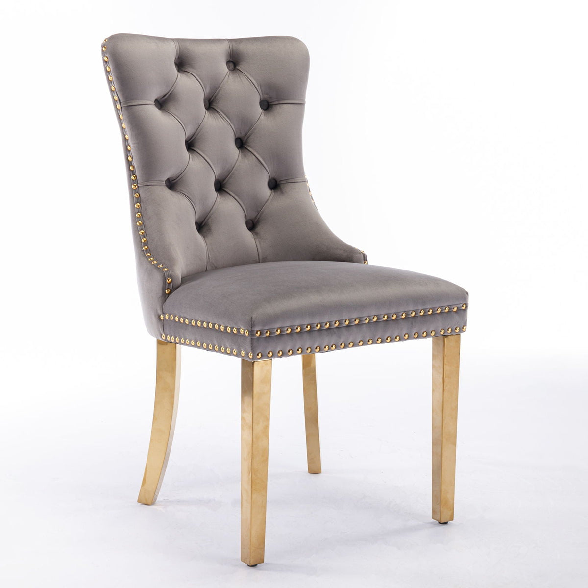Modern tufted dining chair with gray velvet upholstery, gold nailhead trim and gold legs on Tampa Home & Garden Store