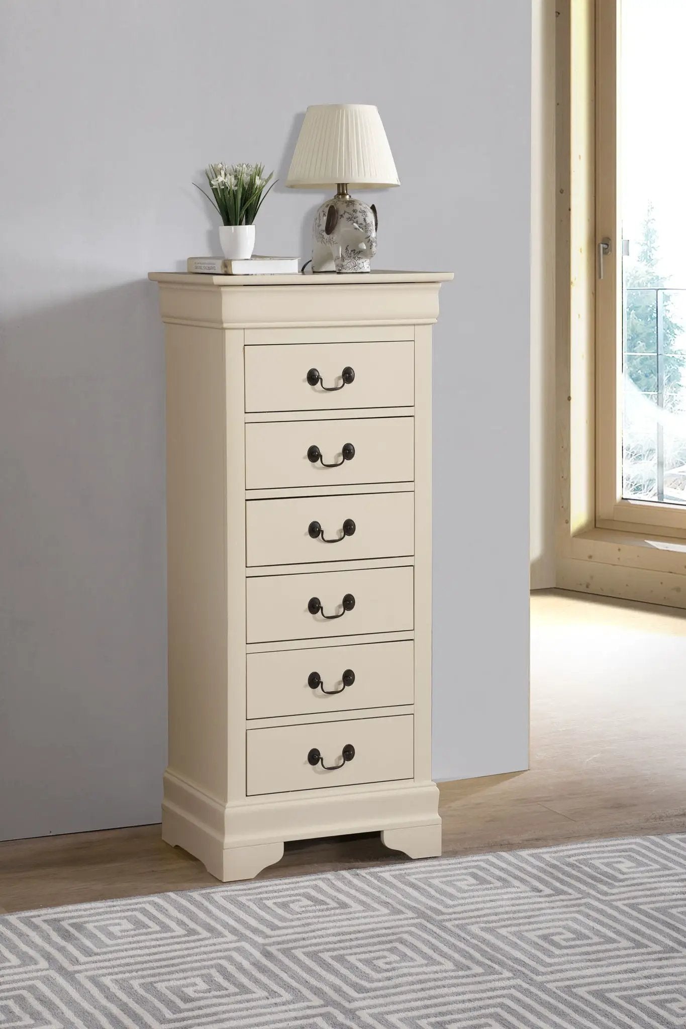 Traditional style lingerie chest in cream finish with drawers; top lamp and plant on Tampa Home & Garden Store