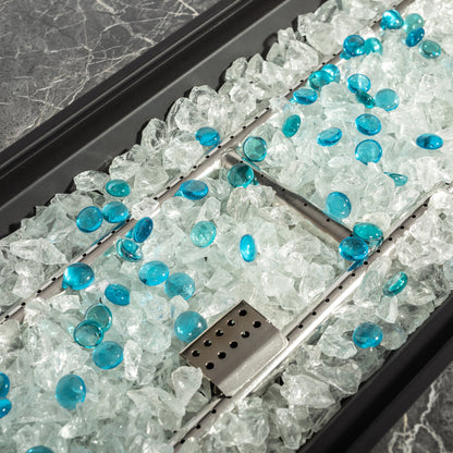 Gas fire pit interior with teal glass beads and crushed ice, perforated burner rail on Tampa Home & Garden Store