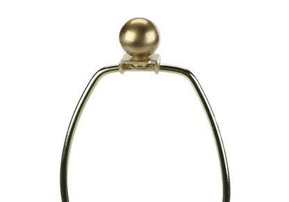 Table lamp with a gold spherical finial and curved brass-tone metal frame on Tampa Home & Garden Store