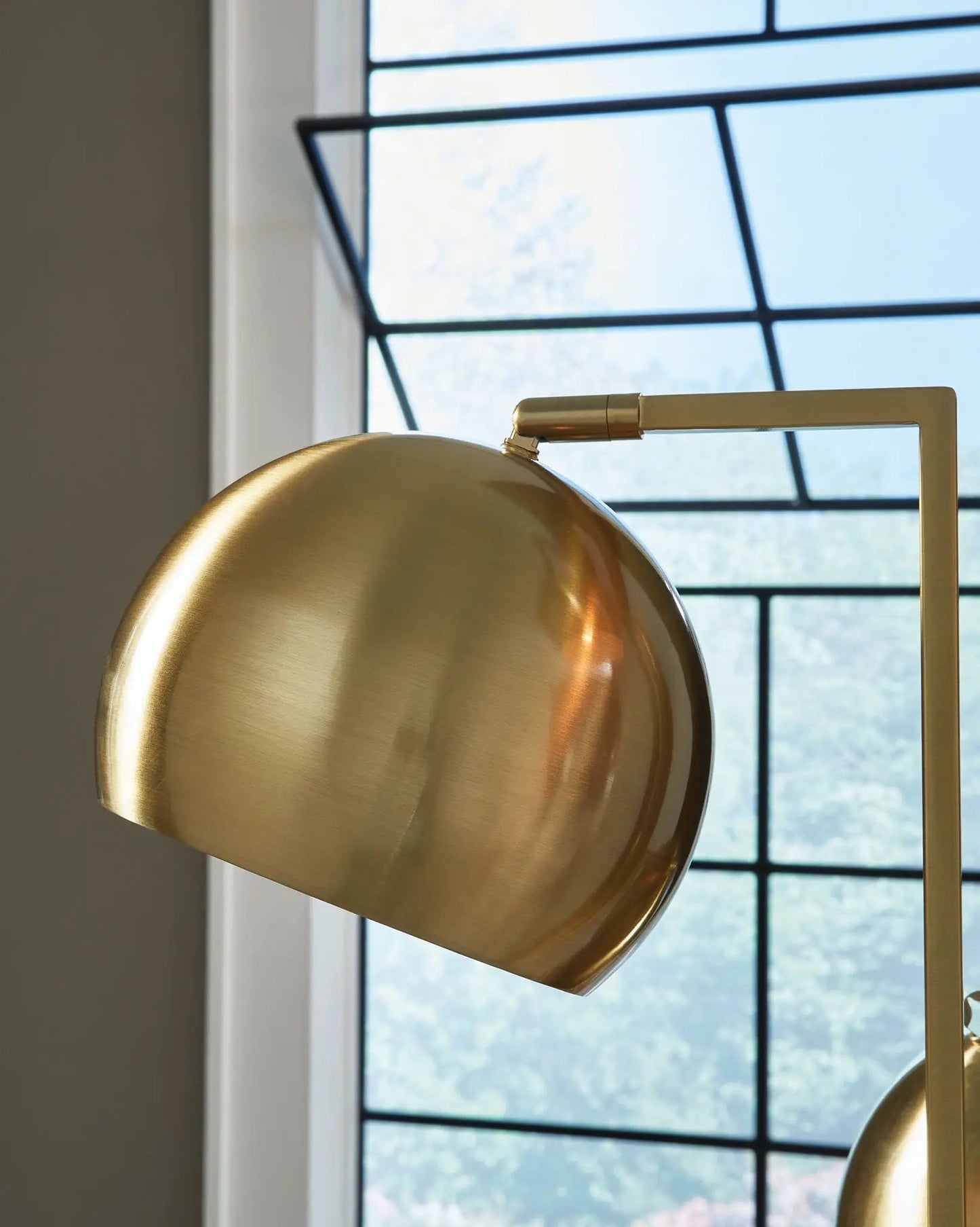 Sorcha metal floor lamp gold finish with black frame close-up of shade and arm on Tampa Home & Garden Store