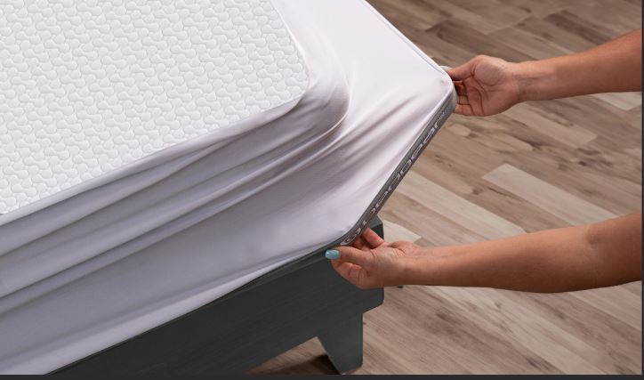 BedGear Kid's Dri-Tec Mattress Protector - Twin, white, being fitted on mattress on Tampa Home & Garden Store