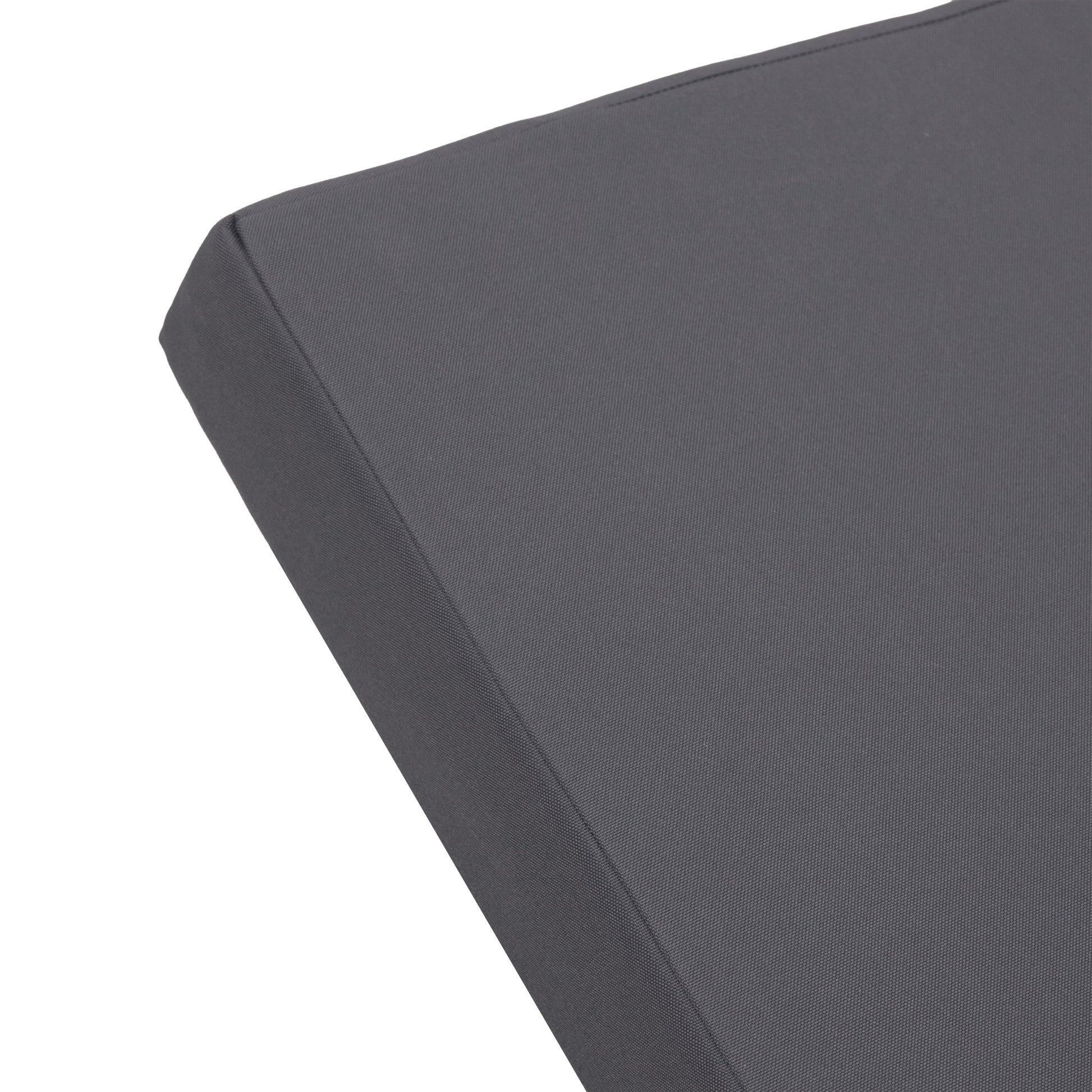 Outdoor chaise lounge cushion close-up in charcoal gray fabric with visible seams on Tampa Home & Garden Store