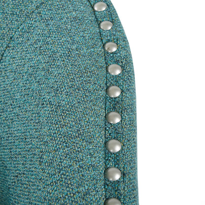 Luxurious swivel chair with pearl silver nailhead trim on teal woven upholstery on Tampa Home & Garden Store