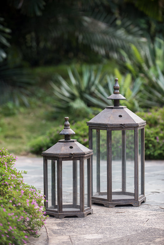 Pair of S/2 Graca Polygon Temple Garden Lanterns in weathered metal with glass panels on Tampa Home & Garden Store