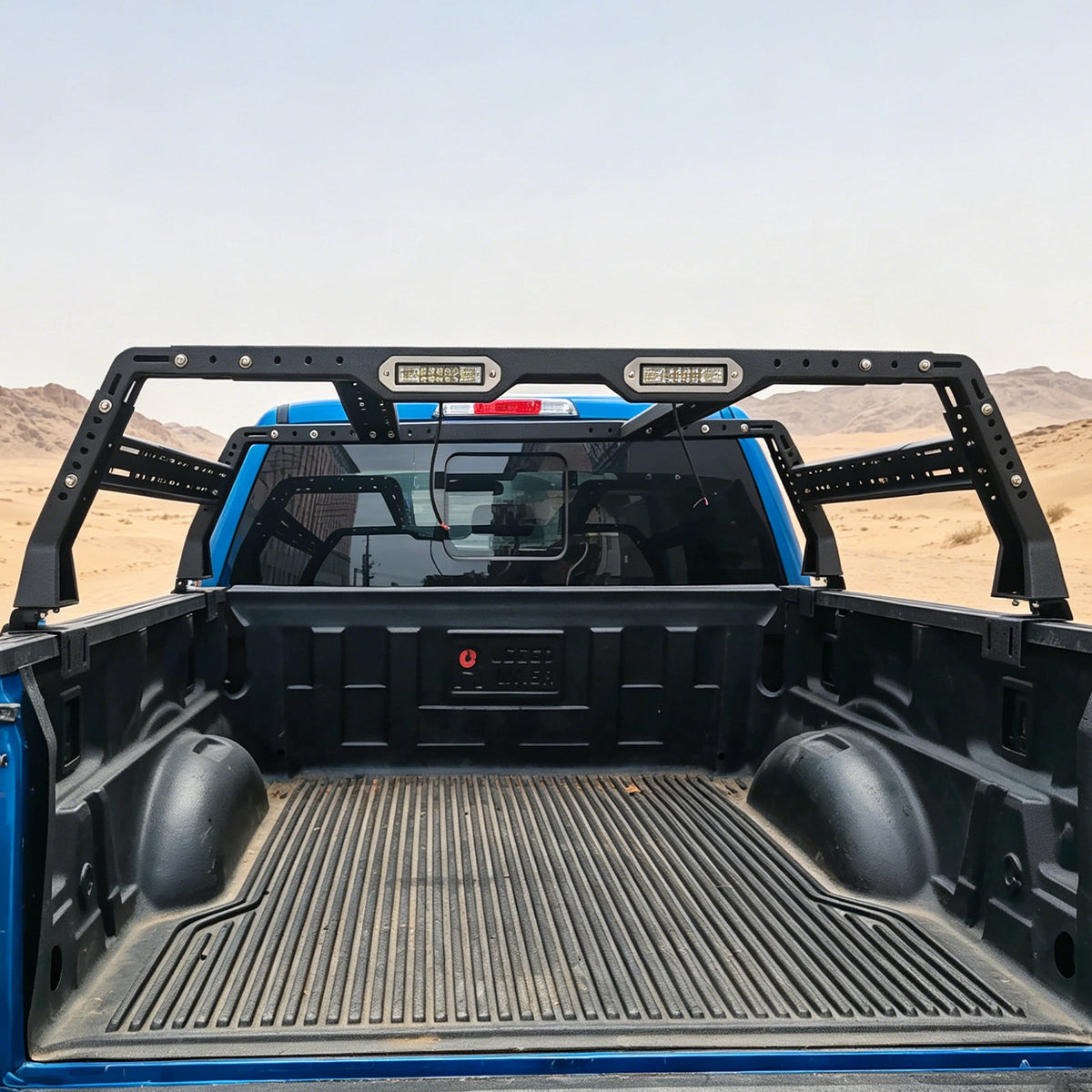 Overland Truck Bed Racks in black powdercoated steel with LED light bars over blue truck bed on Tampa Home & Garden Store