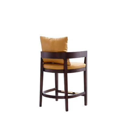 Mid-Century Modern counter height stool with upholstered tan cushions and dark wood frame on Tampa Home & Garden Store