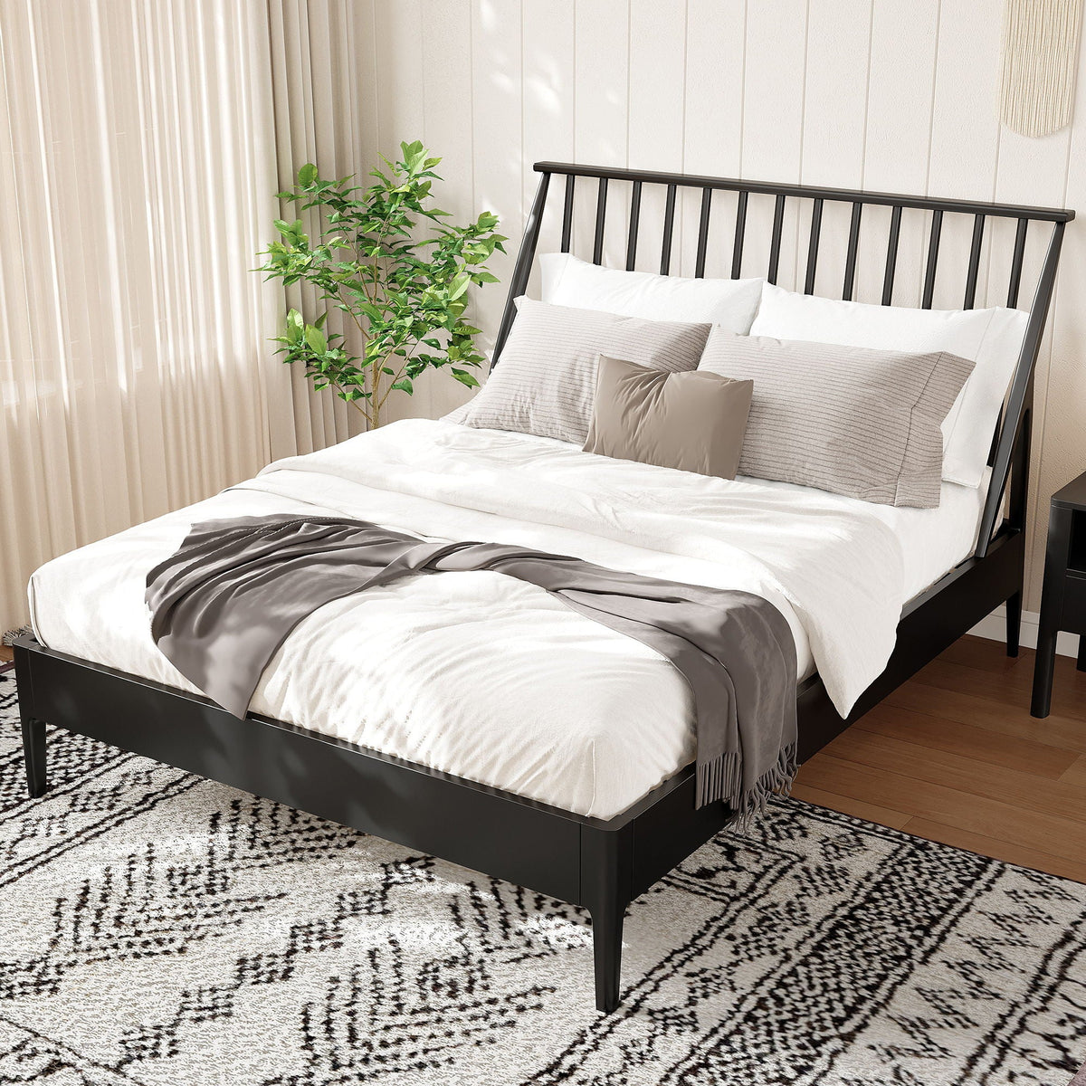 Bohemian platform bed with tall black metal headboard, white bedding and gray accents on Tampa Home & Garden Store