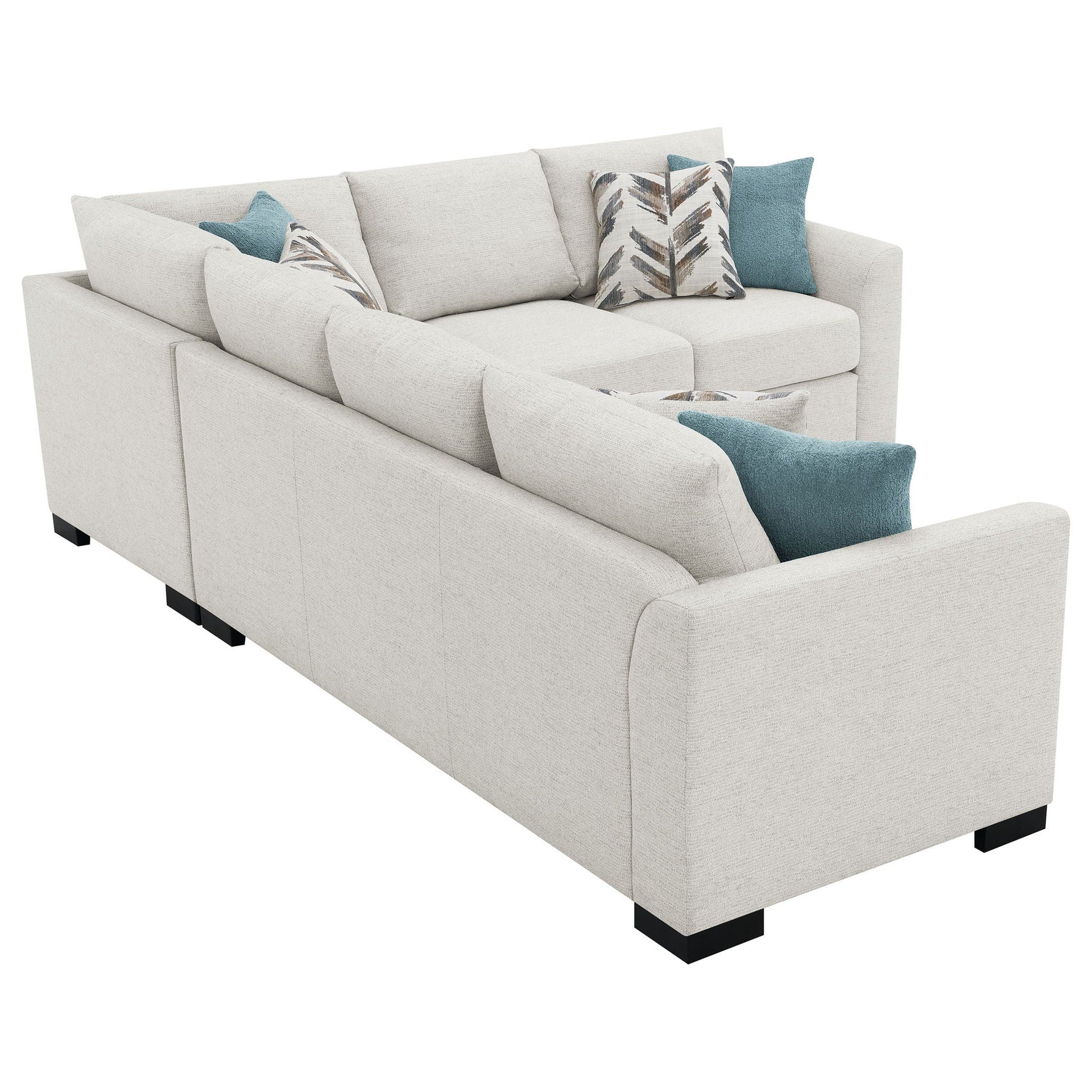 Radison upholstered sleeper sectional sofa in greige fabric with teal and palm leaf pillows on Tampa Home & Garden Store
