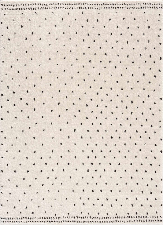 Julie Area Rug by Boutique Rugs in ivory with tiny black dot motif on Tampa Home & Garden Store