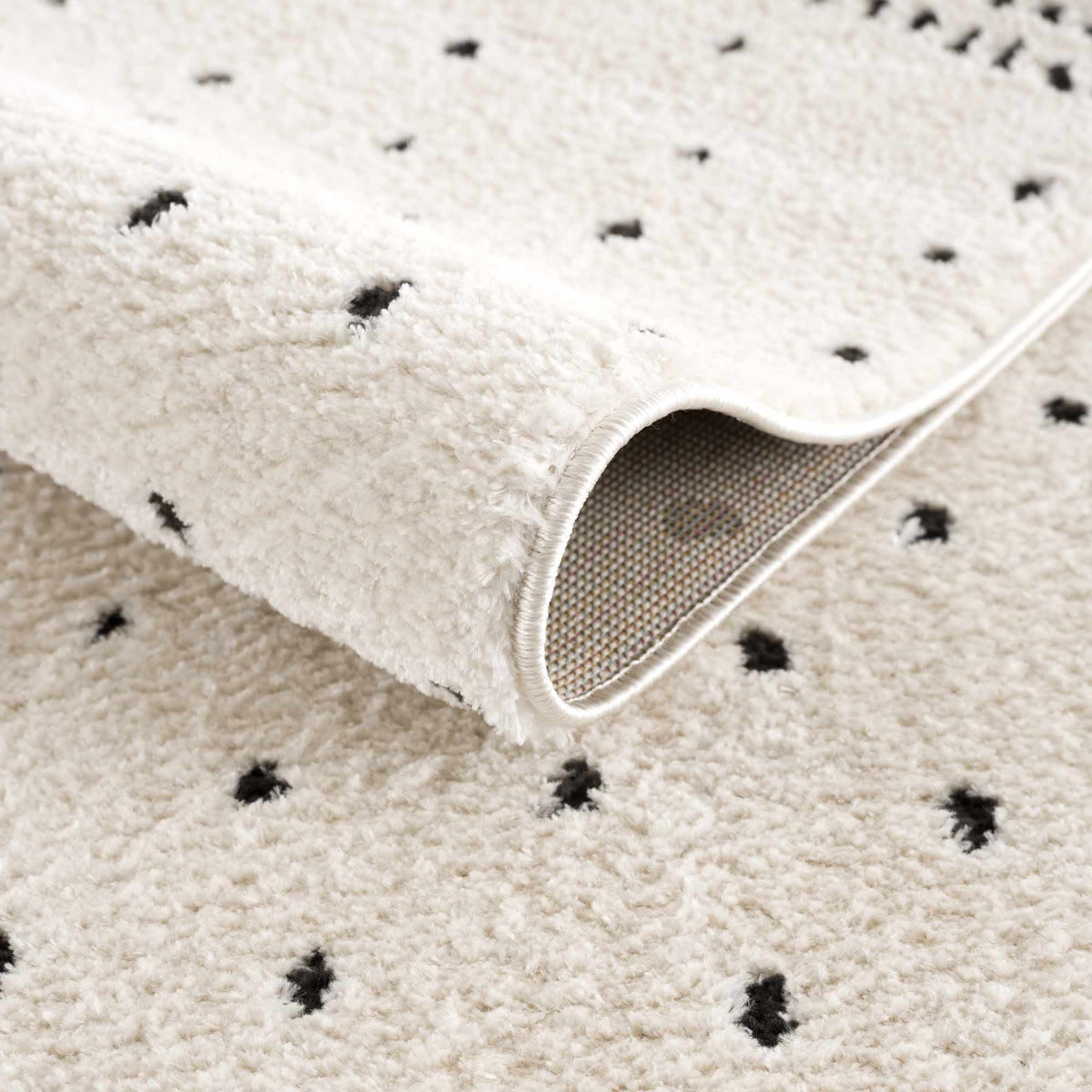 Julie Area Rug cream shag with scattered black spots Boutique Rugs plush pile on Tampa Home & Garden Store