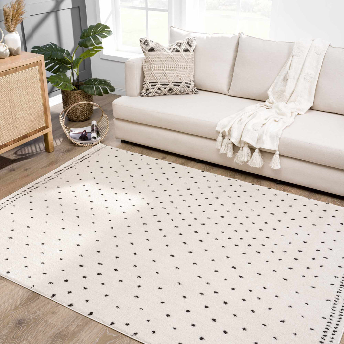 Julie Area Rug white area rug with black polka dot pattern Boutique Rugs brand on Tampa Home & Garden Store