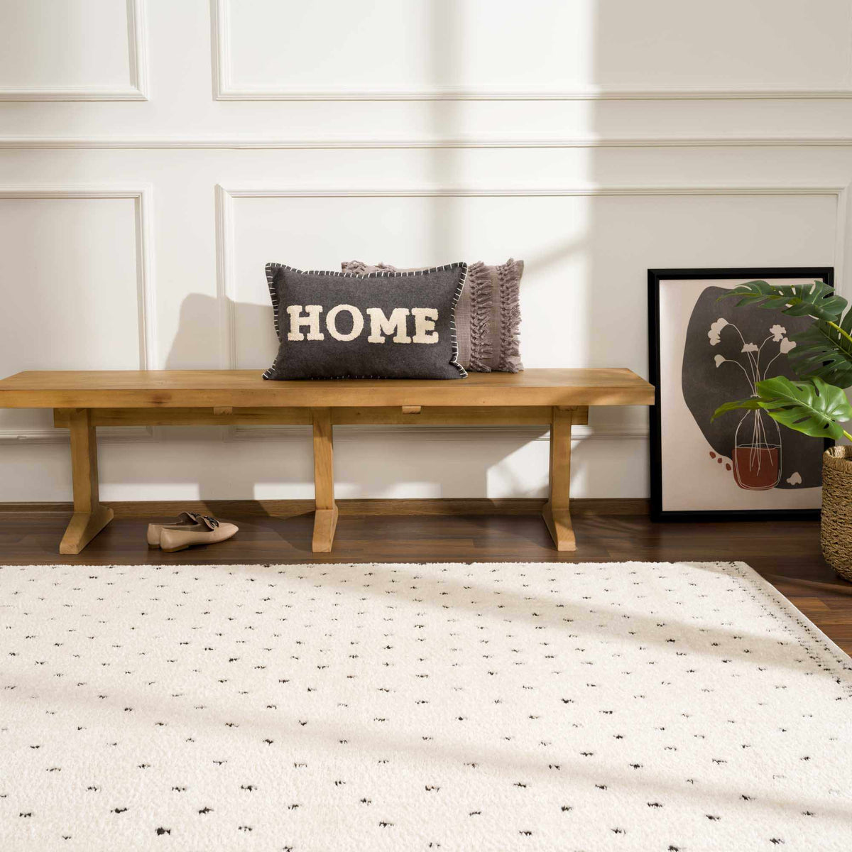 Julie Area Rug Boutique Rugs cream rug with tiny black flecks on hardwood floor on Tampa Home & Garden Store