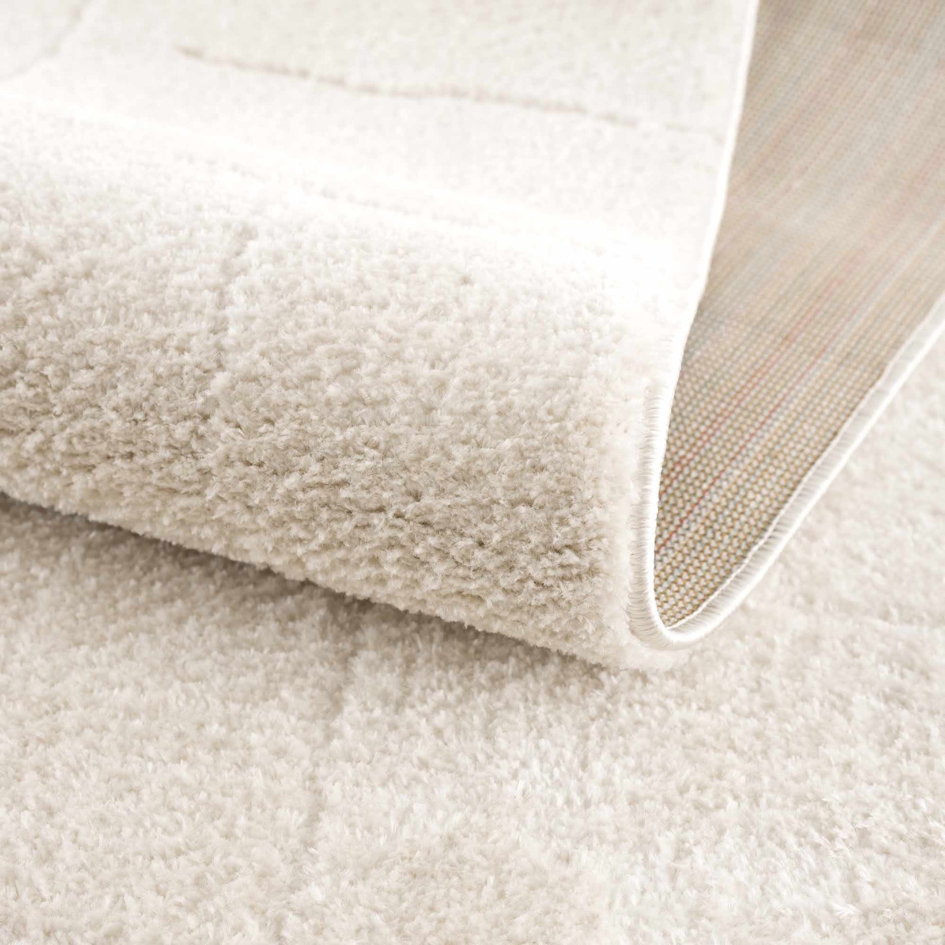 Koume Ivory Area Rug, Boutique Rugs plush ivory shag with soft pile and white edge binding on Tampa Home & Garden Store