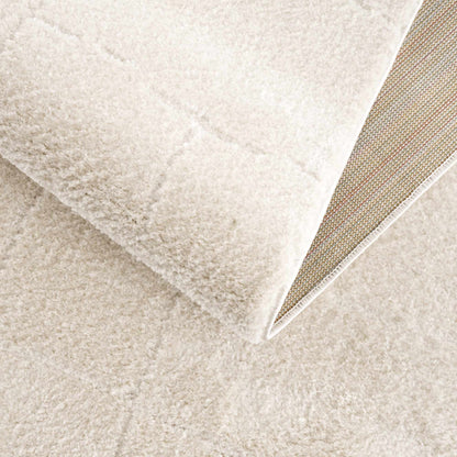 Koume Ivory Area Rug by Boutique Rugs, plush ivory shag with bound edge on Tampa Home & Garden Store