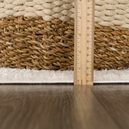 Koume Ivory Area Rug by Boutique Rugs with natural braided jute texture and scale ruler on Tampa Home & Garden Store