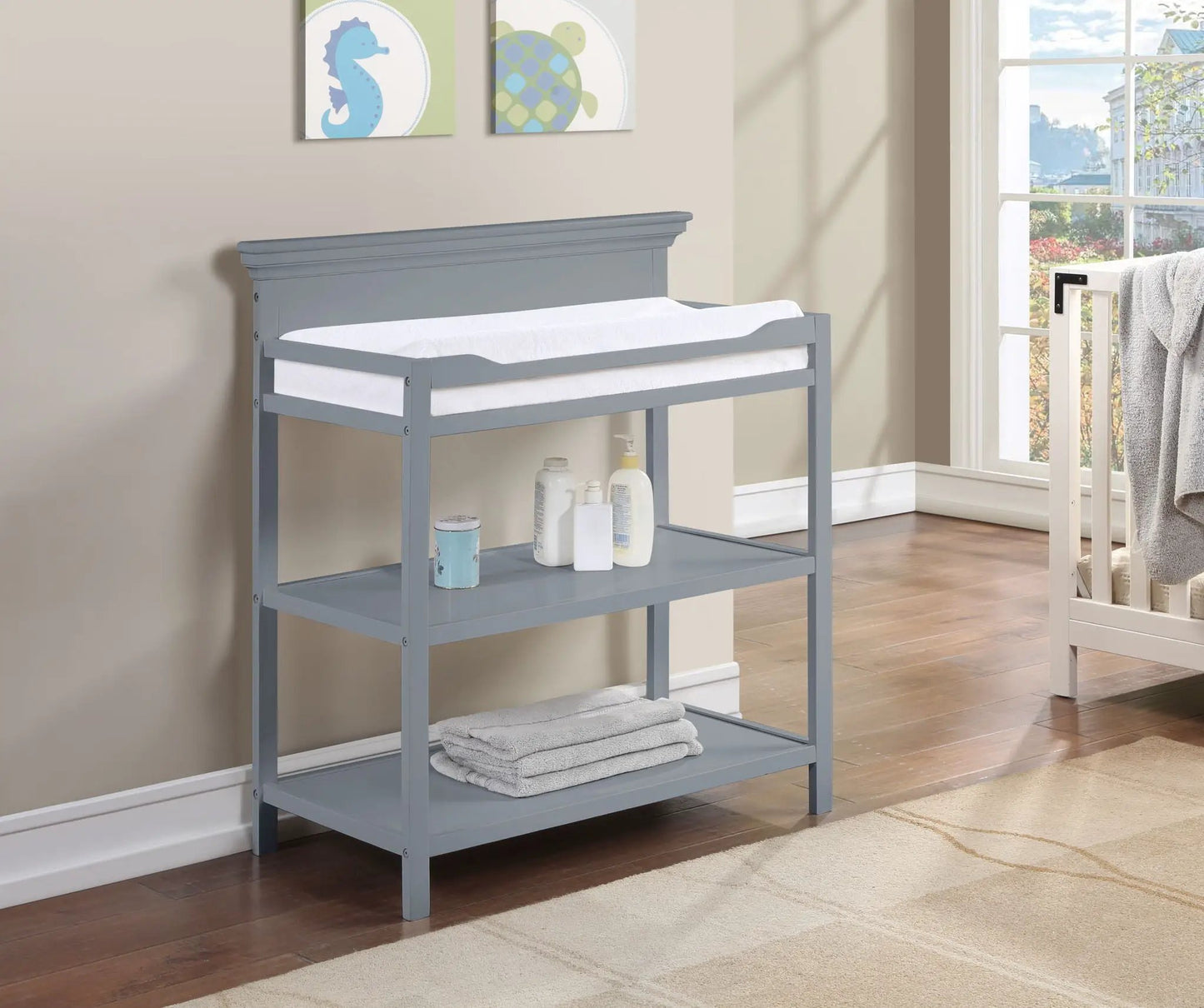 Universal Changing Table by Unique Piece Furniture, gray-blue finish with white pad and shelf on Tampa Home & Garden Store