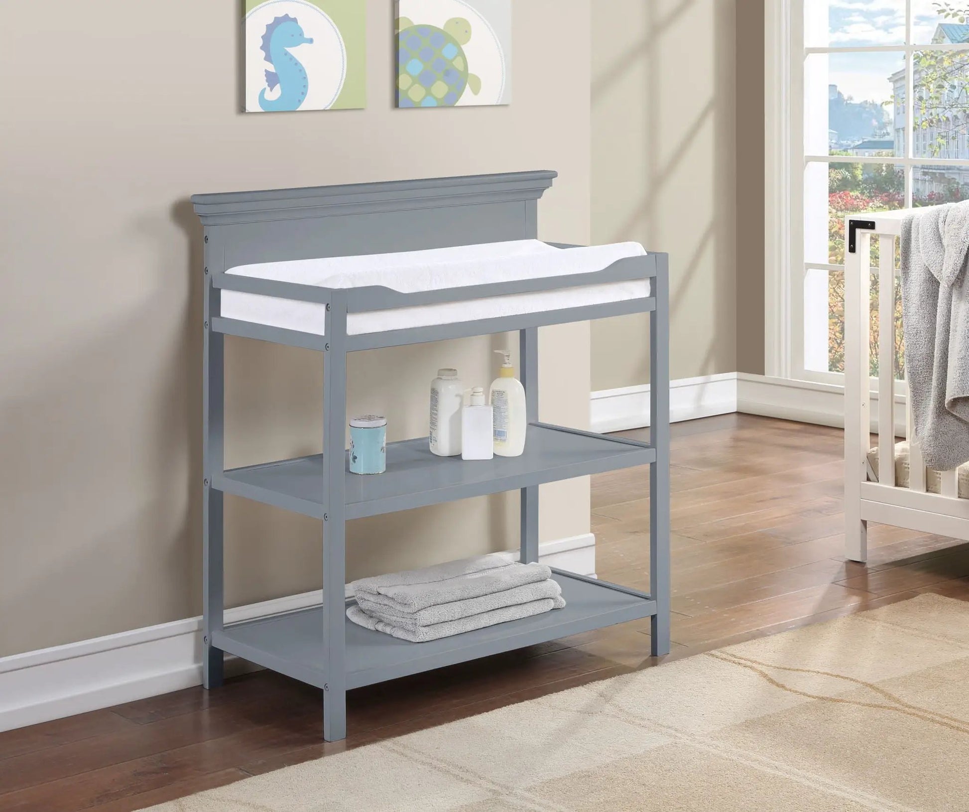 Universal Changing Table by Unique Piece Furniture, gray-blue finish with white pad and shelf on Tampa Home & Garden Store