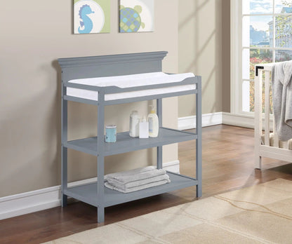 Universal Changing Table by Unique Piece Furniture, gray-blue finish with white pad and shelf on Tampa Home & Garden Store