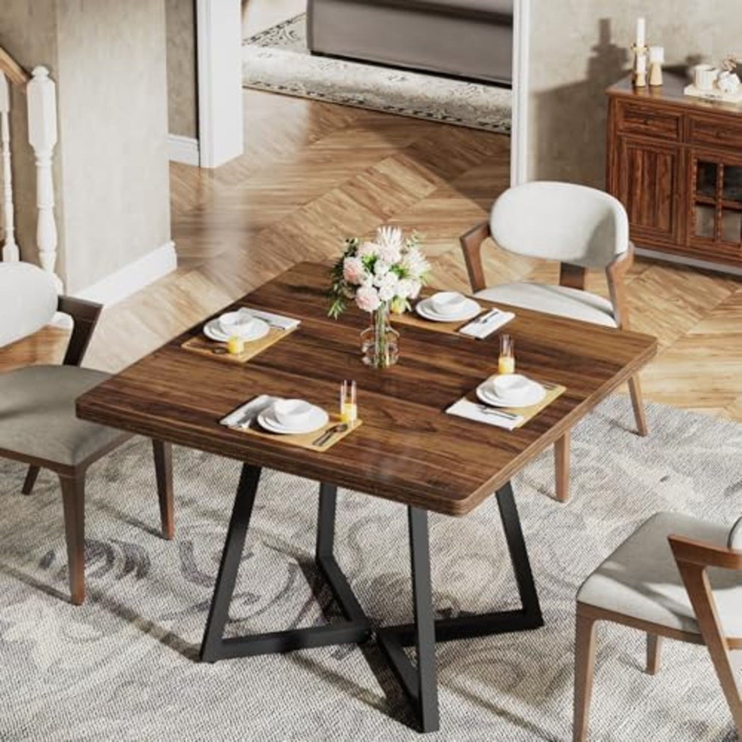 Square dining table in brown wood with black legs, four place settings in a dining room on Tampa Home & Garden Store