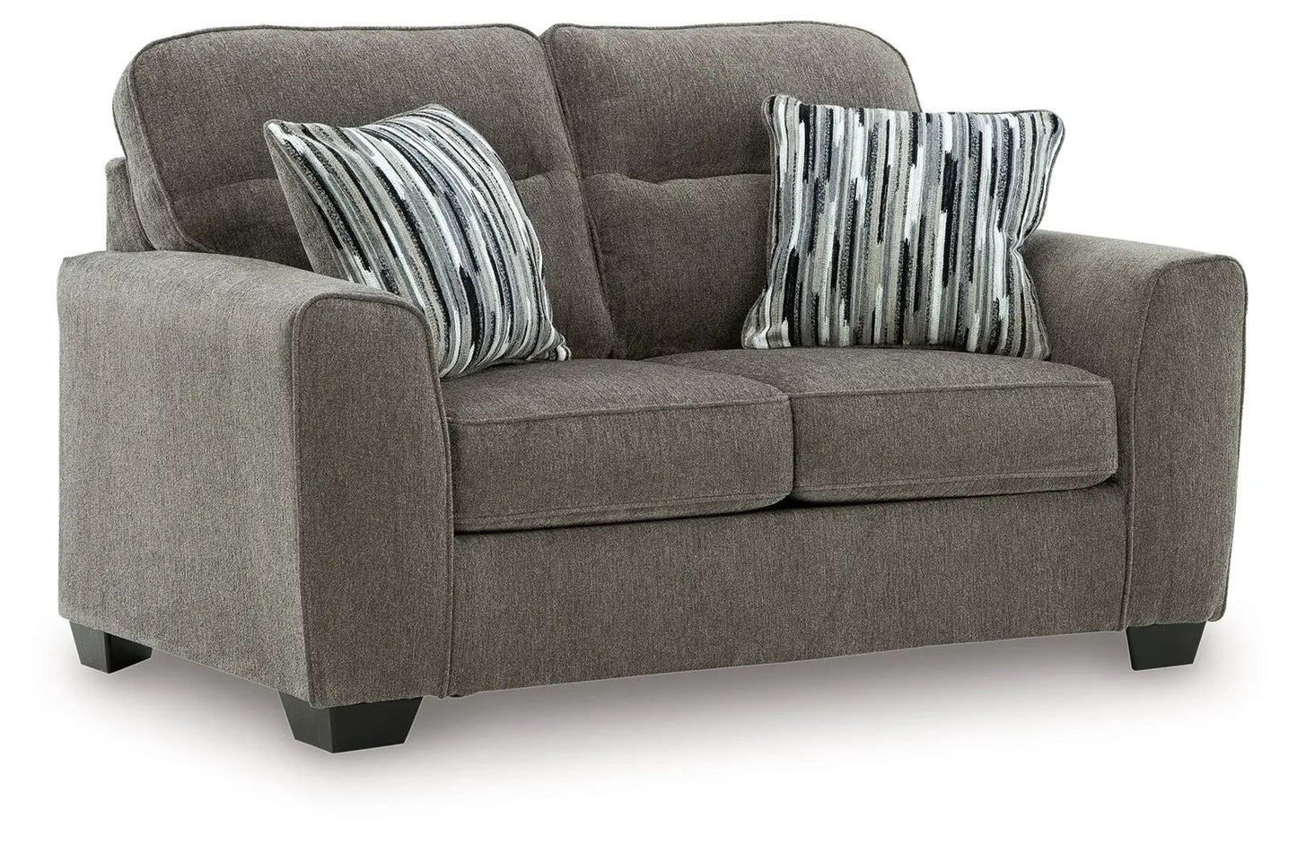 Olten stationary chair in taupe gray fabric with two striped pillows and dark block feet on Tampa Home & Garden Store