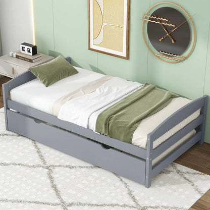 Platform bed with trundle in gray finish, white linens and sage-green throw, wall art and round clock on Tampa Home & Garden Store