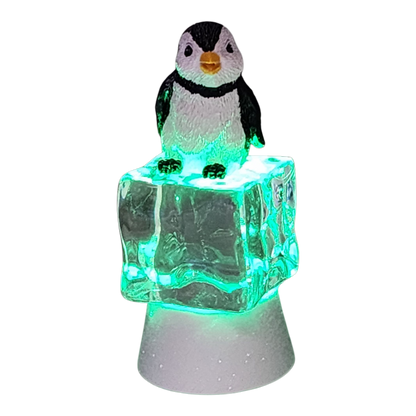 Penguin Sitting on Color-changing Lighted Icecube figurine with LED base on Tampa Home & Garden Store