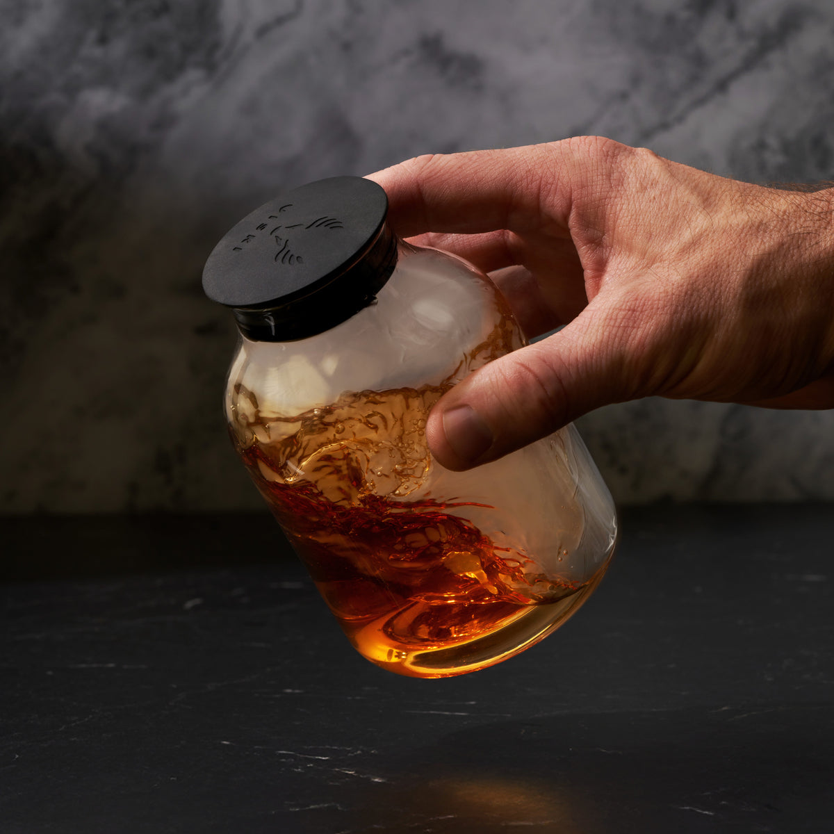 5 Piece Stacking Smoked Cocktail Kit lid by Viski, matte black cap on amber glass bottle on Tampa Home & Garden Store