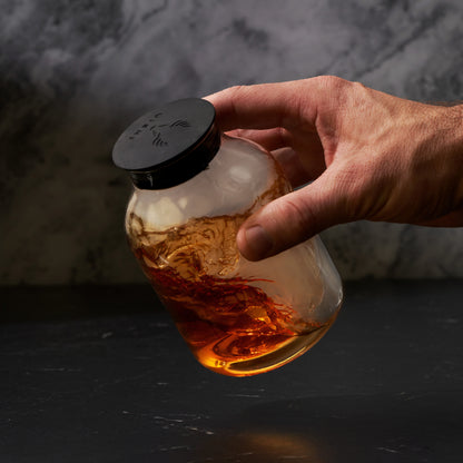 5 Piece Stacking Smoked Cocktail Kit lid by Viski, matte black cap on amber glass bottle on Tampa Home & Garden Store