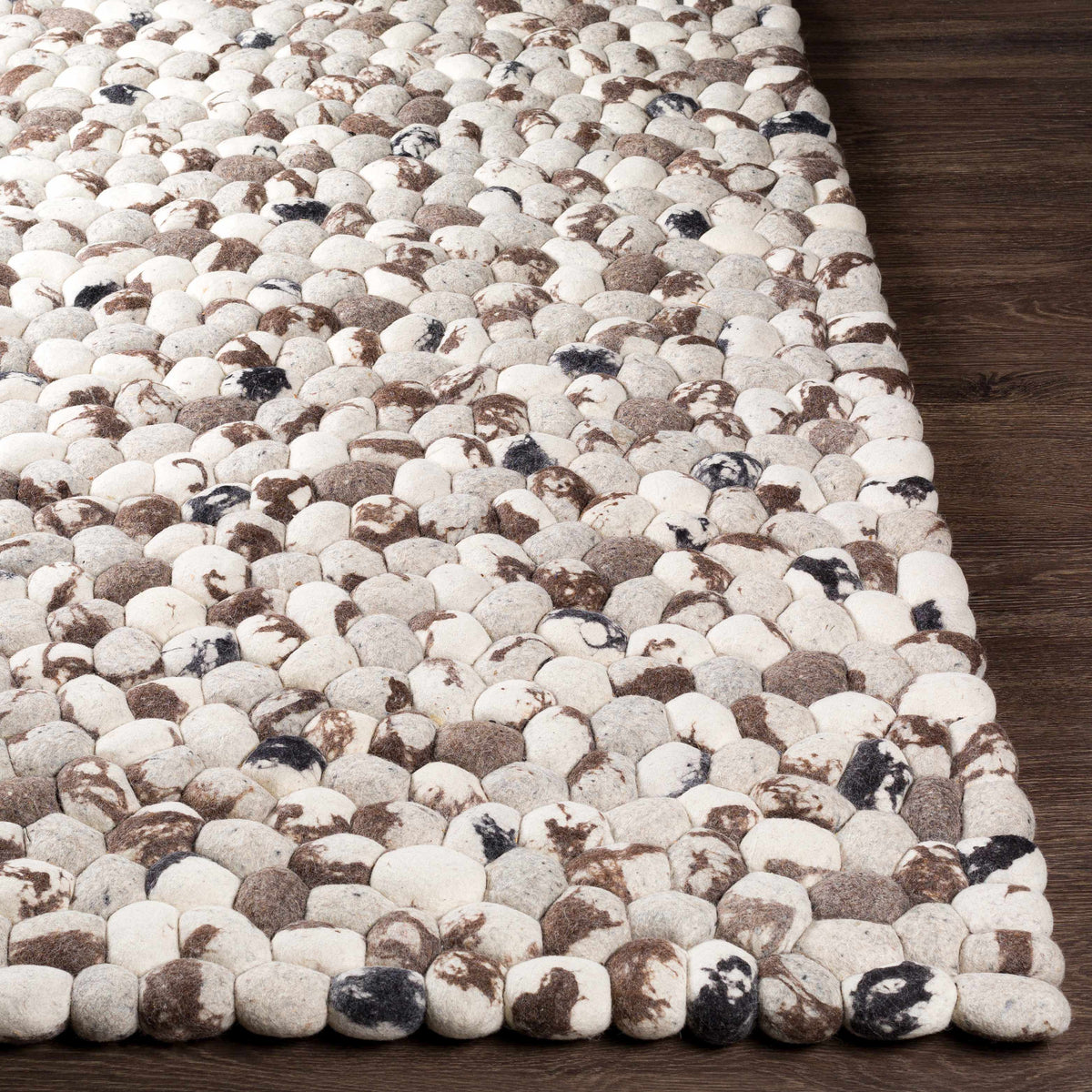 Fillmore Carpet rug by Boutique Rugs with pebble pattern in white beige brown on wood floor on Tampa Home & Garden Store