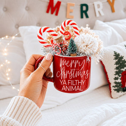 Ya Filthy Animal mug, red ceramic with white script, holds candy canes and mini Christmas tree on Tampa Home & Garden Store