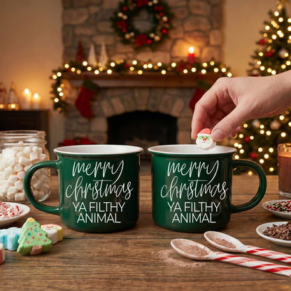 Two green Gia Roma coffee mugs with white Merry Christmas Ya Filthy Animal text on Tampa Home & Garden Store
