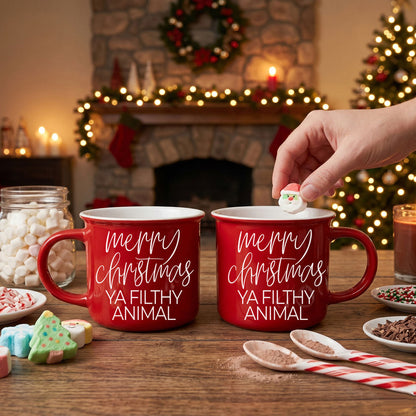 Two red ceramic Gia Roma Ya Filthy Animal coffee mugs with white script on a festive table on Tampa Home & Garden Store