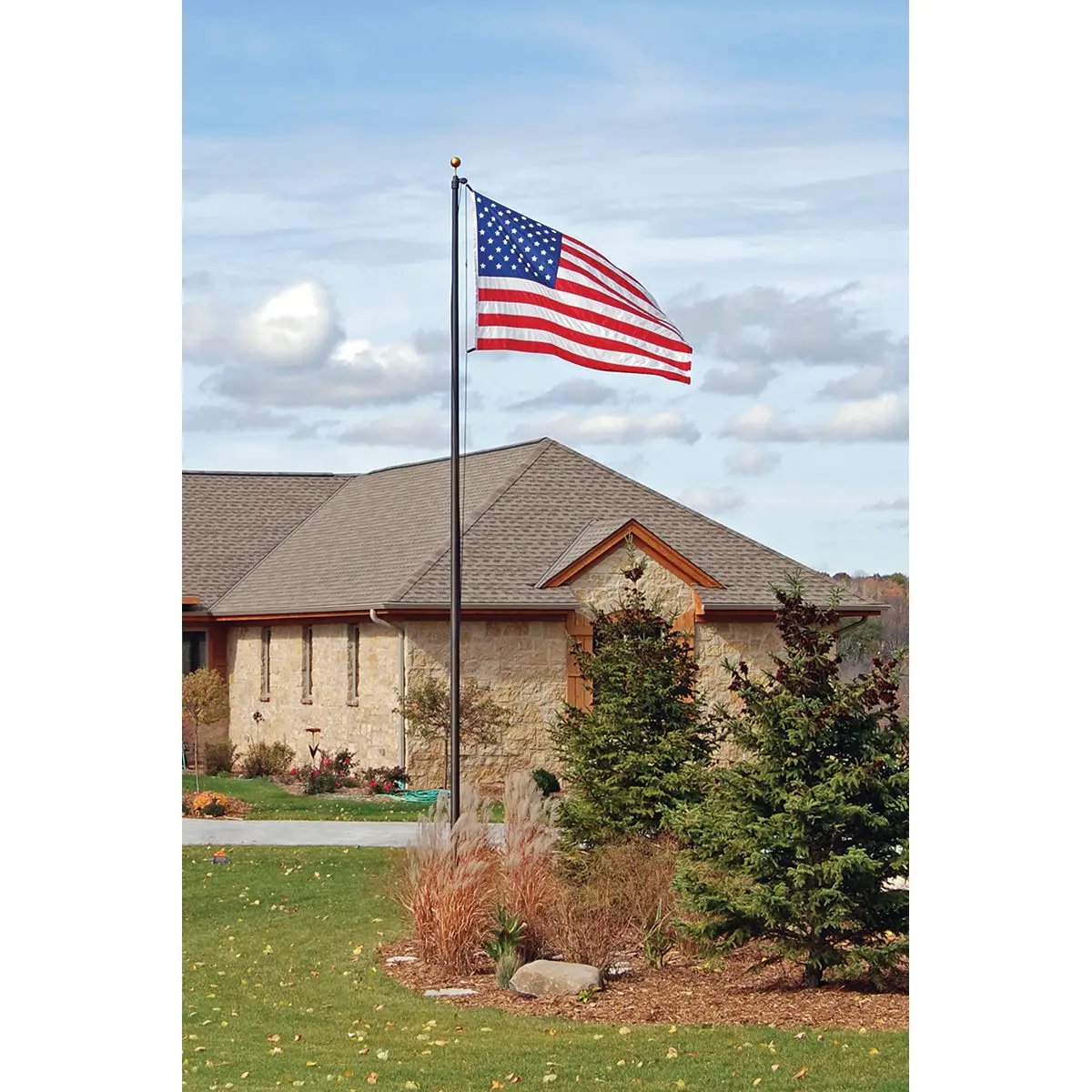 Aluminum flagpole with external rope, American flag waving over a suburban yard on Tampa Home & Garden Store
