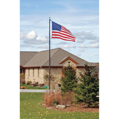 Aluminum flagpole with external rope, American flag waving over a suburban yard on Tampa Home & Garden Store