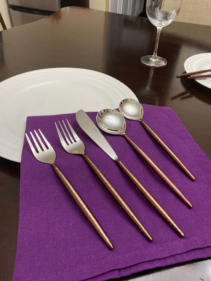 Hammered stainless steel flatware with brown copper handles, 5-piece display on purple napkin on Tampa Home & Garden Store