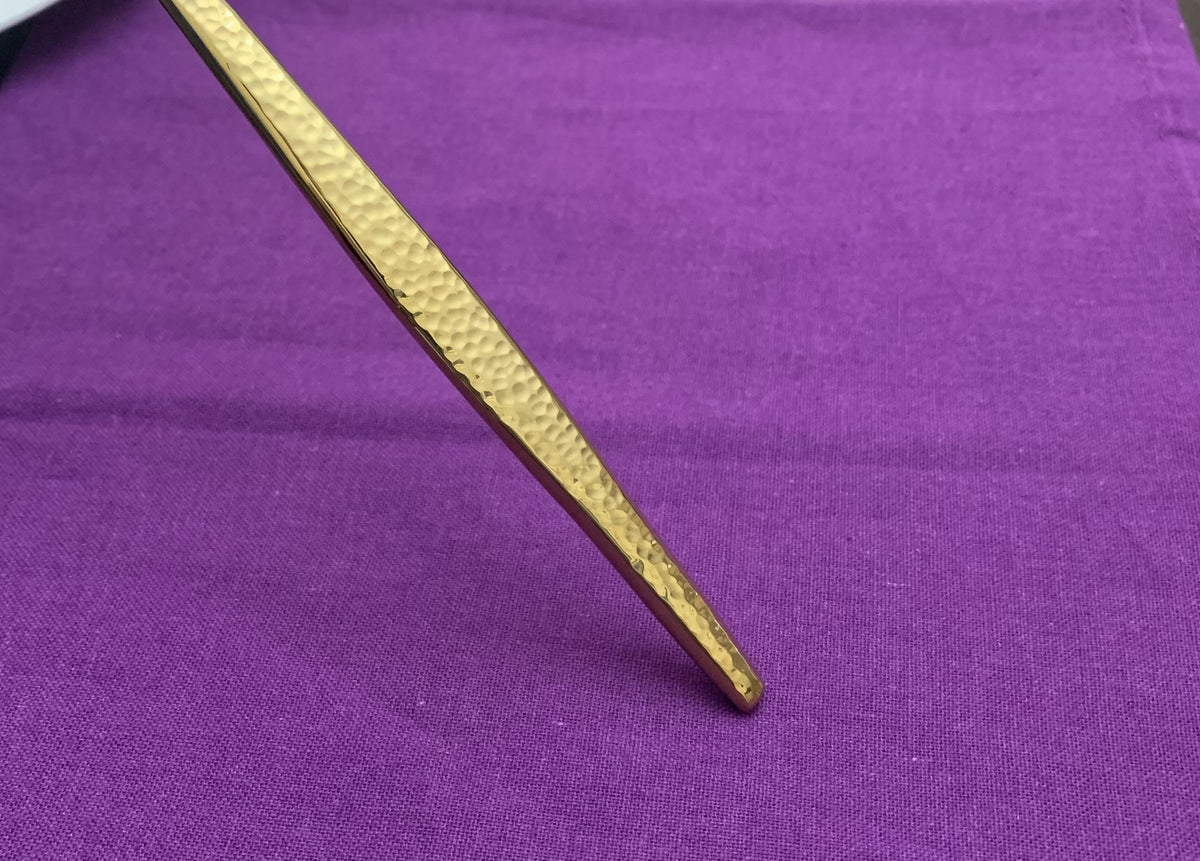 Vibhsa hammered gold flatware handle close-up, part of a 20-piece service for 4 on Tampa Home & Garden Store