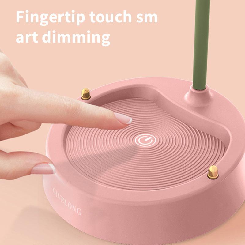 Pink flower LED desk lamp with round touch-control base and green stem for bedroom decor on Tampa Home & Garden Store