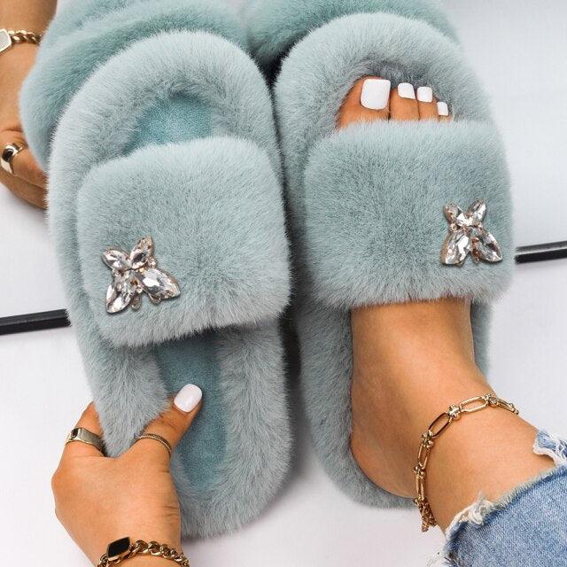 Women Stevvex faux fur slippers in light blue with rhinestone butterfly accents on Tampa Home & Garden Store