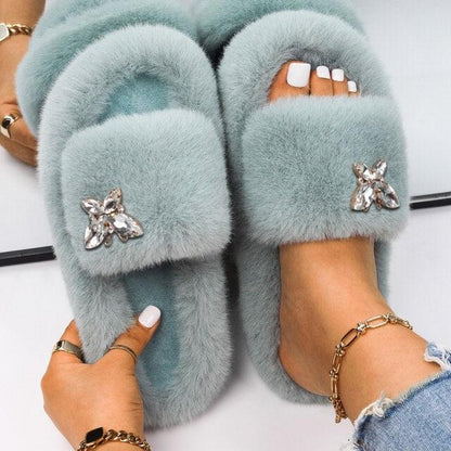 Women Stevvex faux fur slippers in light blue with rhinestone butterfly accents on Tampa Home & Garden Store