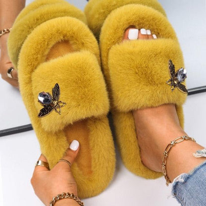 Women Stevvex faux fur slippers pair in mustard yellow with rhinestone butterfly accents on Tampa Home & Garden Store