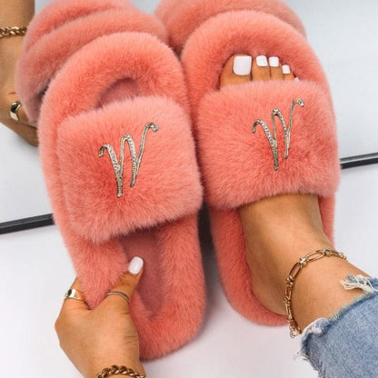 Stevvex pink faux-fur slippers with rhinestone butterfly emblem pair on Tampa Home & Garden Store