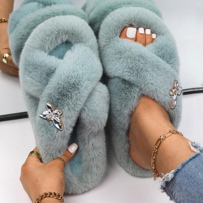 Women’s faux fur slippers with rhinestone butterfly accents, light teal pair by Stevvex on Tampa Home & Garden Store