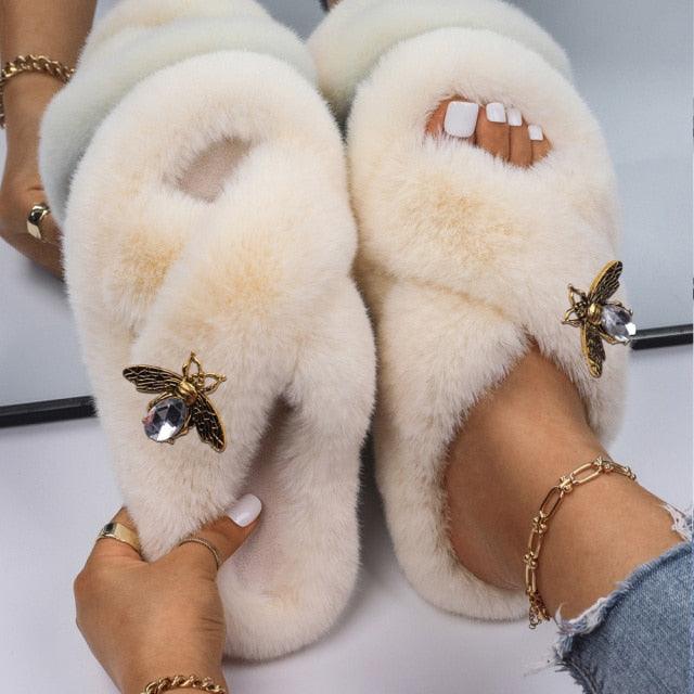 Women faux fur slippers in cream white with rhinestone butterfly accents, pair on Tampa Home & Garden Store