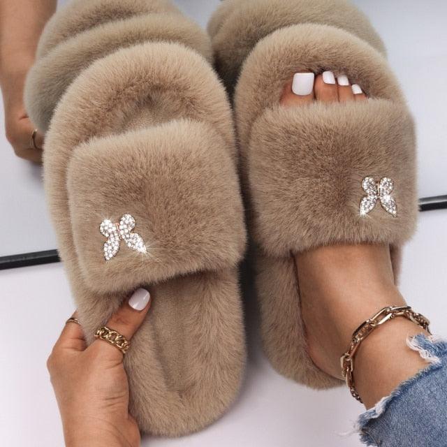 Stevvex women's faux fur slippers tan with rhinestone butterfly embellishments pair on Tampa Home & Garden Store