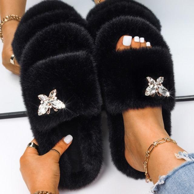 Stevvex women's black faux fur slippers with rhinestone butterfly embellishments pair on Tampa Home & Garden Store