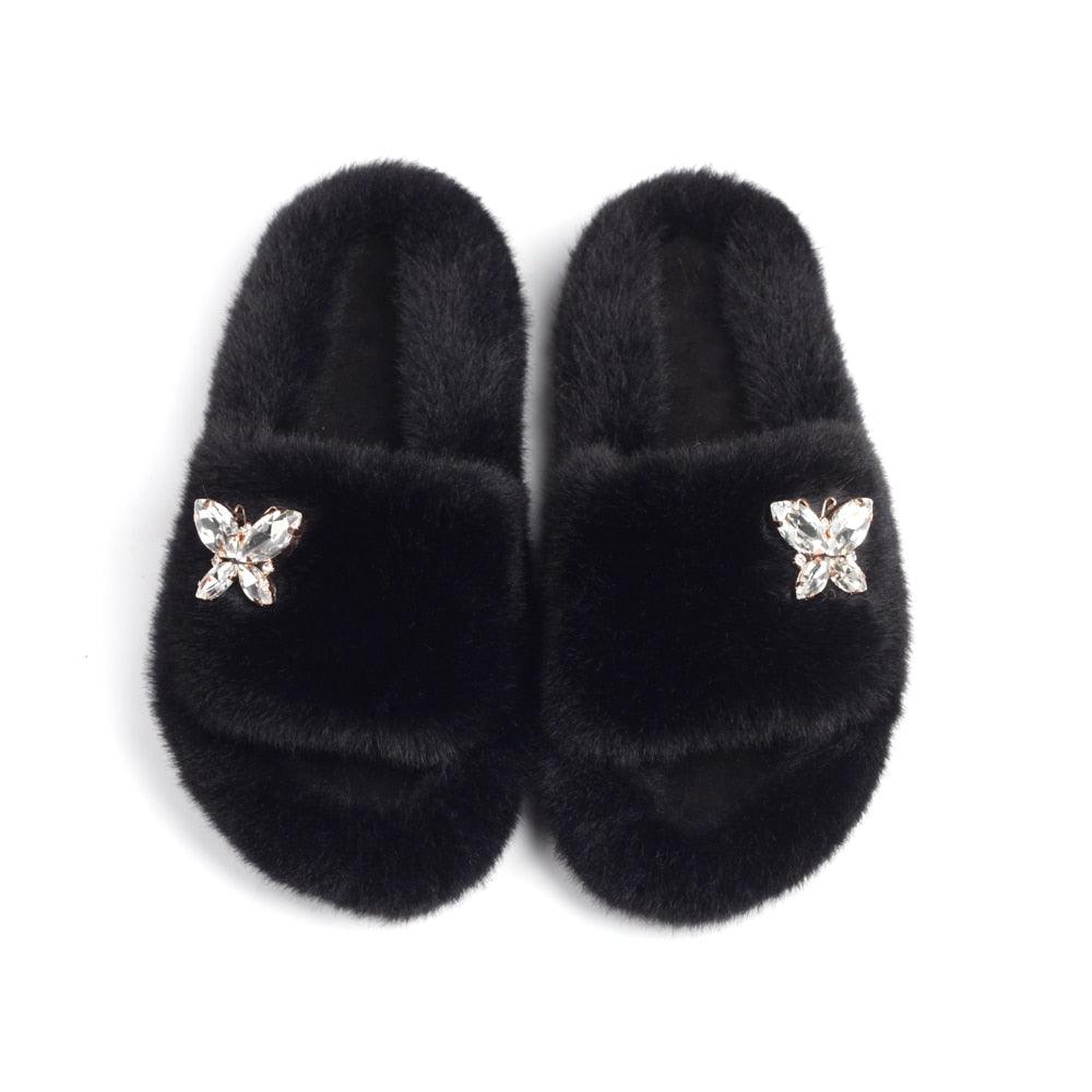 Women’s faux fur slippers with rhinestone butterfly accents, black Stevvex plush slippers on Tampa Home & Garden Store