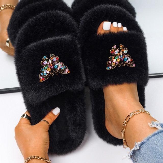 Women's black faux fur slippers with multicolor rhinestone butterfly embellishments, plush slide pair on Tampa Home & Garden Store