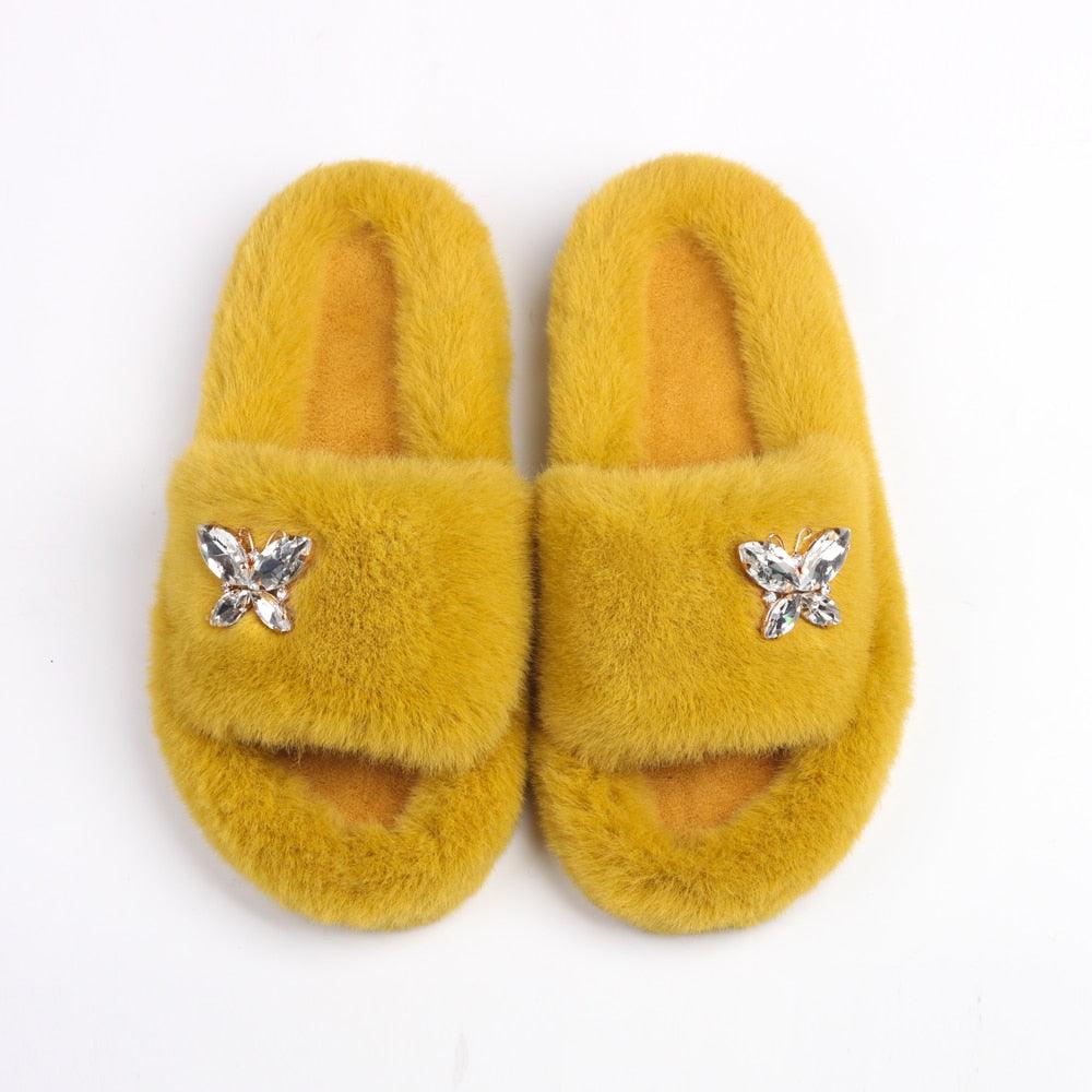 Stevvex women faux fur slippers yellow pair with rhinestone butterfly embellishments on Tampa Home & Garden Store