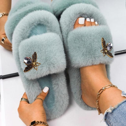 Women Stevvex faux fur slippers light blue pair with rhinestone butterfly accents on Tampa Home & Garden Store